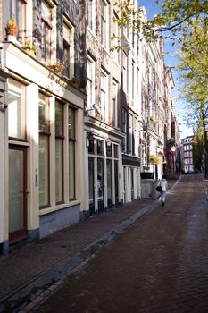 scene in the old town of amsterdam, netherlands