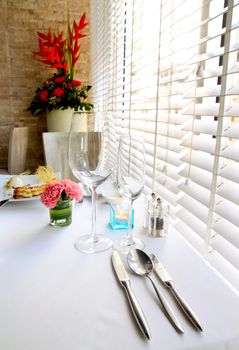 Kitchenware set on the table with decorated flower