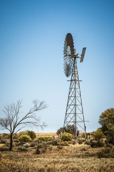 An image of a farming windmill in the australian outback