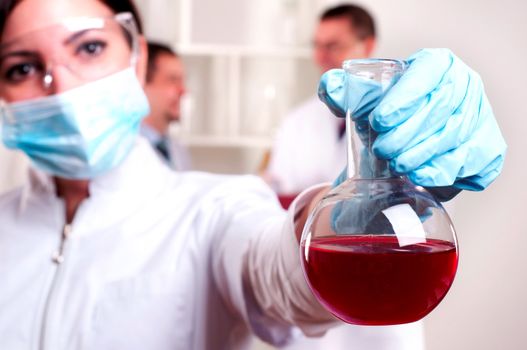 chemist working in the laboratory, mix liquid