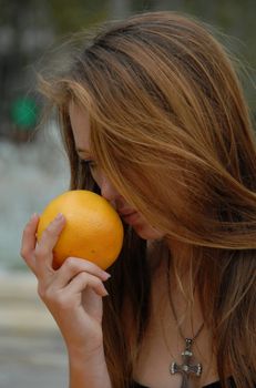 young teen in a market in montpellier for buy citrus fruits
 