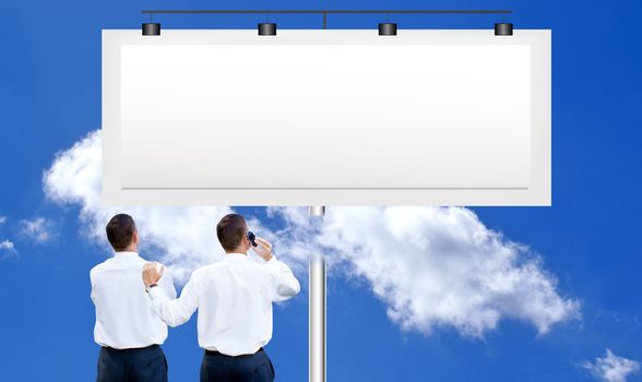 The people against a publicity board and the bright blue cloudy sky