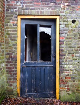 Old door in a ruin farmhouse