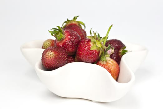 A bowl full of freshly picked natural growned strawberries