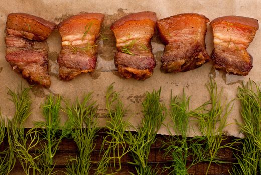 Roast meet with fat on the wooden table