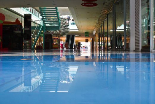 Early scene of a lobby in a large shopping mall in city center