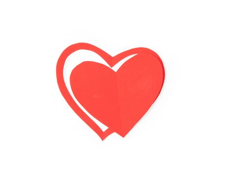 Paper heart on red background