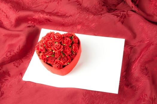 Valentine's day box rose on white paper