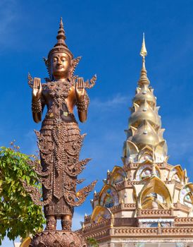 Golden pagoda and thai angel in Petchchaboon, Thailand