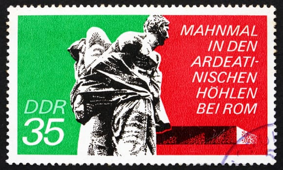 GDR - CIRCA 1974: a stamp printed in GDR shows Bound Guerrillas, Ardeatine Caves, Rome, Ardeatine massacre, circa 1974