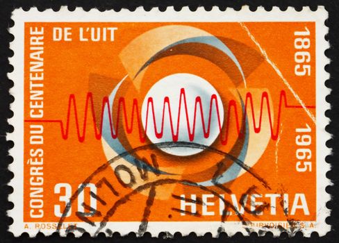 SWITZERLAND - CIRCA 1965: a stamp printed in the Switzerland shows Symbol of Communications and Waves, Centenary of the International Telecommunication Union, circa 1965