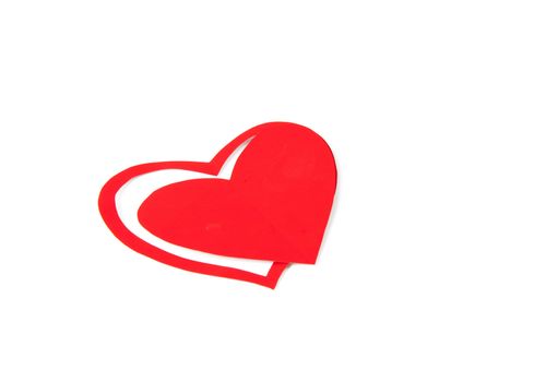 Paper heart on red background