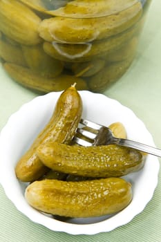 Fresh salted cucumber in bowl