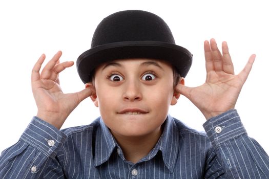 Boy with bowler hat mocking over white 