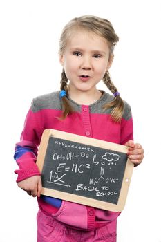 young girl holding slate on white background