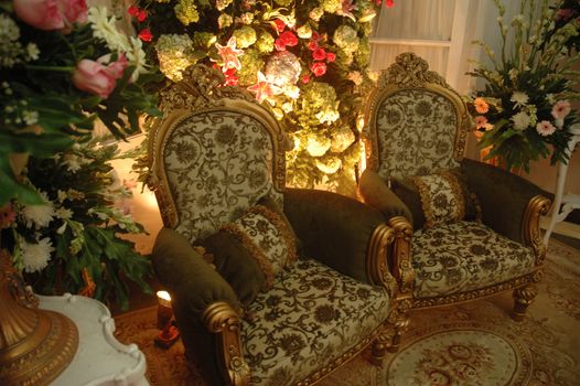 a set of wedding chair that decorated with beautiful flower bud