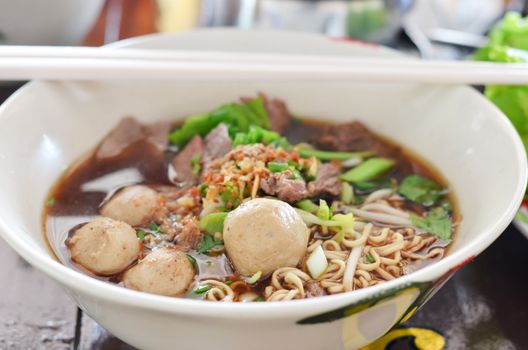 Instant noodles and  meatball  with chopsticks , asian noodle