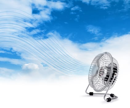 Electric fan blowing fresh air stream blue sky background