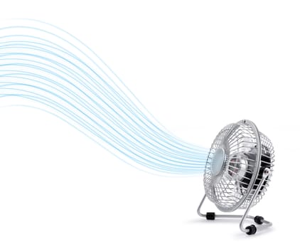 Electric table top fan blowing cool fresh air stream