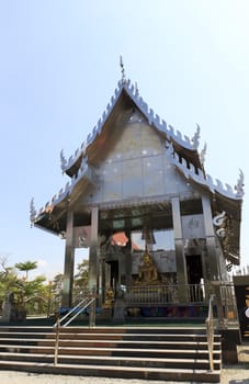 Stainless steel temple on clear blue sky in thailand.