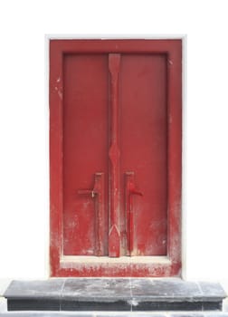 Red door with white wall on a smooth format.