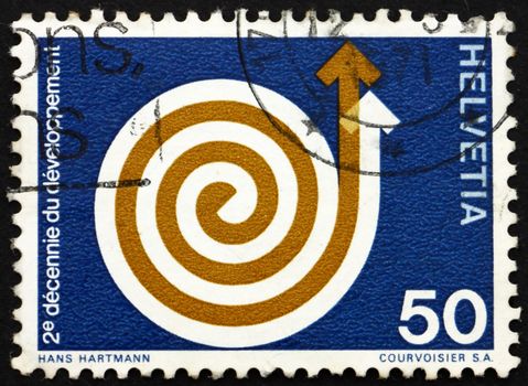 SWITZERLAND - CIRCA 1971: a stamp printed in the Switzerland shows Rising Spiral, 2nd Decade of Development Aid, circa 1971