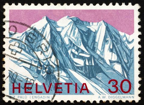 SWITZERLAND - CIRCA 1970: a stamp printed in the Switzerland shows View of Piz Palu, Grisons, Swiss Alps, circa 1970