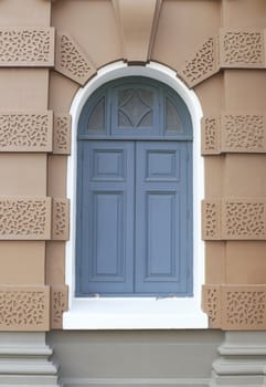 Blue door with brown wall on a new format.