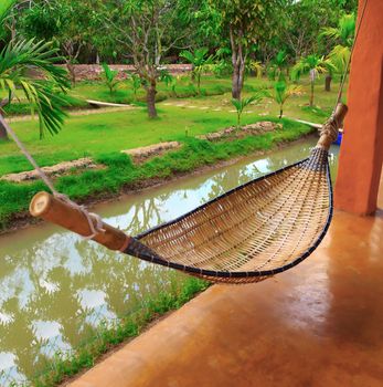 View of nice hammock hanging between two pillar.