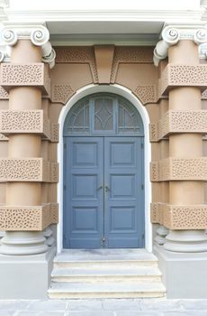 Blue door with brown wall on a new format.