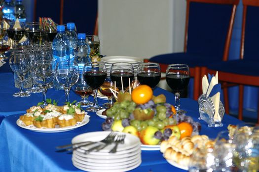 served table with tablewares fruit and mineral water