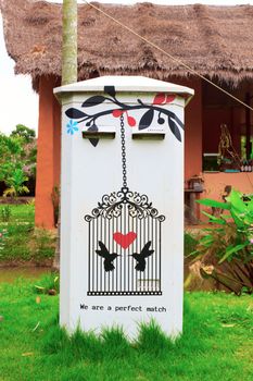 White and Traditional thai postbox on garden.