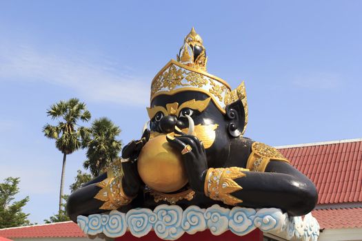 Rahu statue of giant in traditional Thai style molding art in Wat Sman Rattanaram in Chachoengsao province at thailand.
