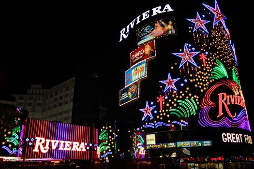 Las Vegas, USA - August 26, 2009: The Riviera Hotel and Casino is one of the first flashy hotel casinos to open on Las Vegas Boulevard in 1955.  Seen here is the brightly decorated sign near the main entrance to the building.