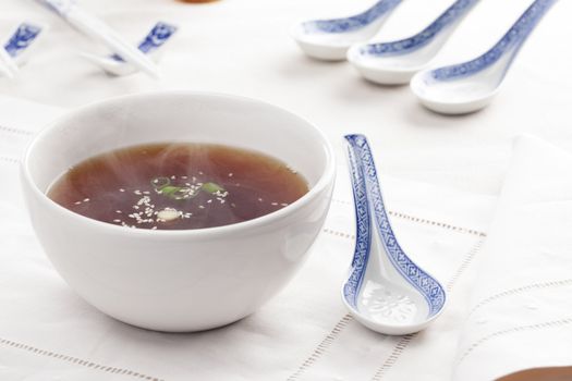 Hot miso soup with traditional spoons