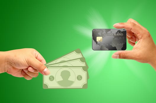 Credit card in human hand with money