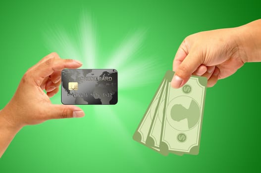 Credit card in human hand with money