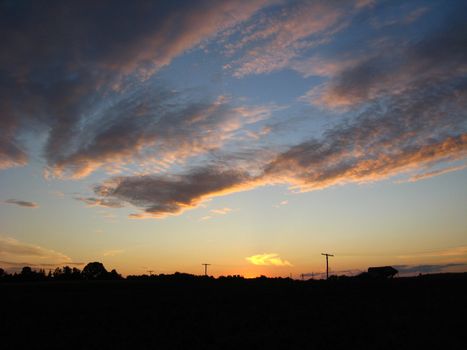 The landscape with beautiful picturesque clouds and sunset