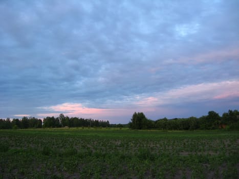 The landscape with beautiful picturesque clouds on the sunset