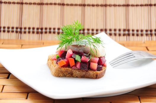 Sandwiches with rye bread, herring and vegetables