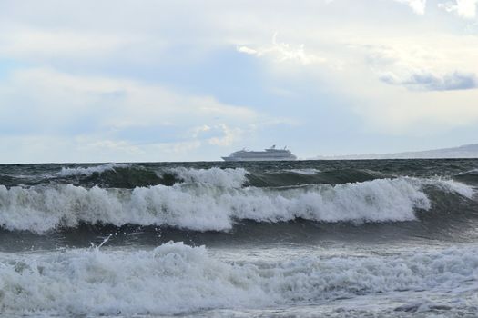 Outbound ship at sea during a storm in Malaga