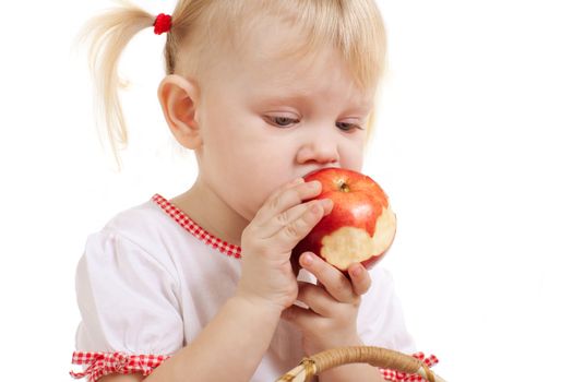 small girl eating apple