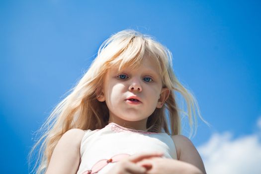 portrait of a girl under the blue sky