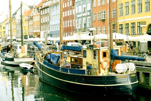 Boatsi in the canal of Nyhavn in Copenhagen, Denmark. Taken on May 2012.