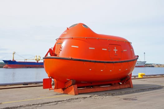 The life boat is on a mooring in port