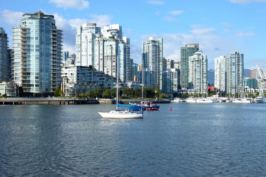 Vancouver BC high rises and False Creek river Canada.