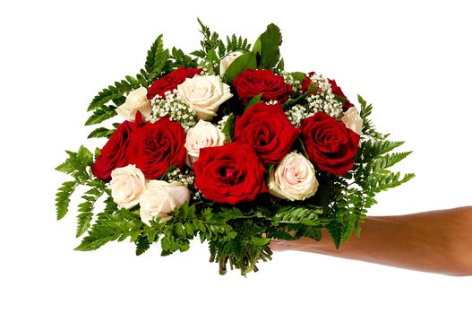 A womans hand is holding a bouquet of flowers isolated on white background