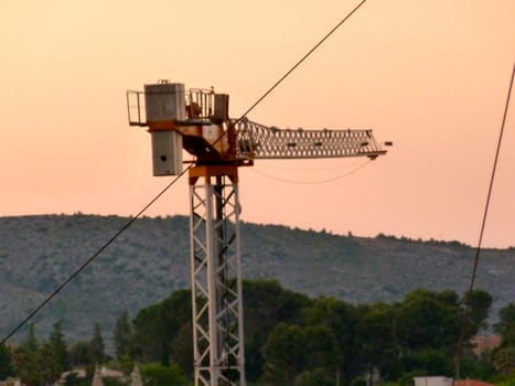 construction crane against a twilight sky