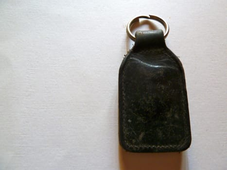 black leather keyfob on white as a background