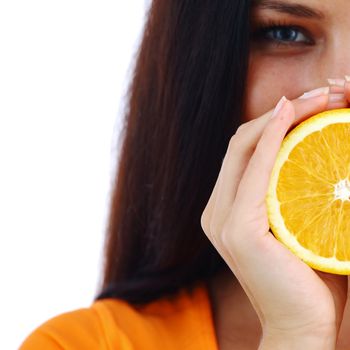 orange in woman hands close up